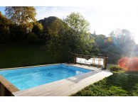 Piscine Bois Luxe Rectangulaire, 520x320x131 cm. Design élégant, structure en bois durable avec garantie de 15 ans, idéale pour détente familiale et relaxation quotidienne dans un cadre luxueux.